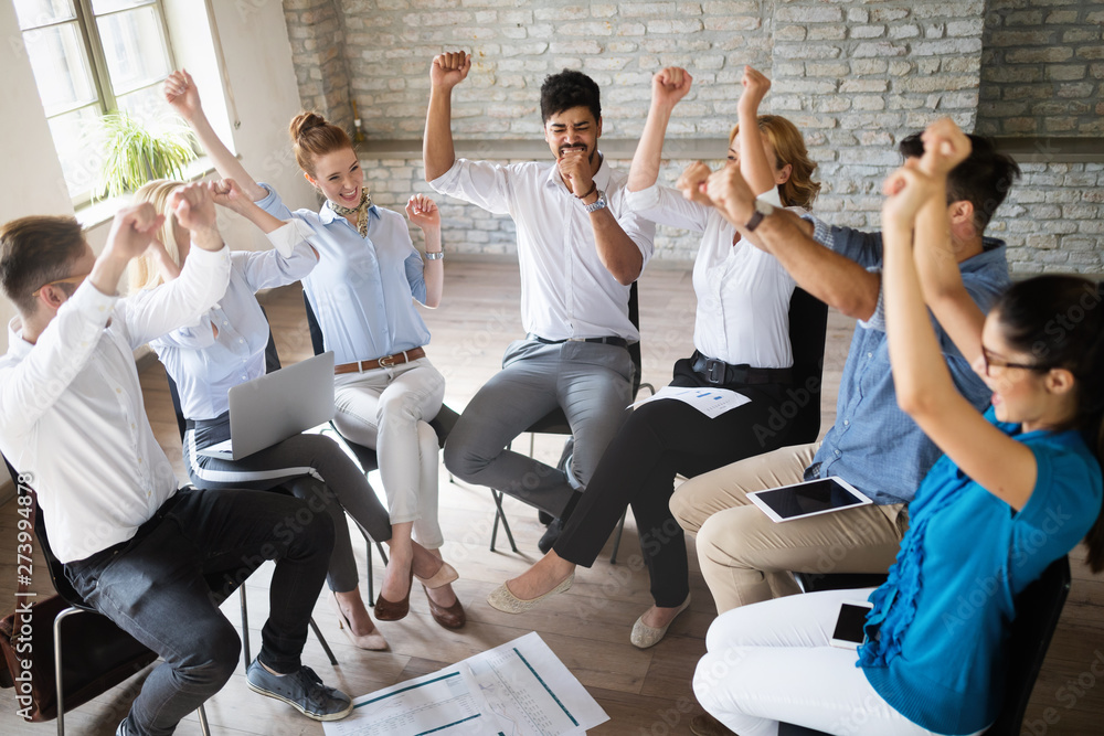 Fototapeta premium Happy success business team celebrating victory in office