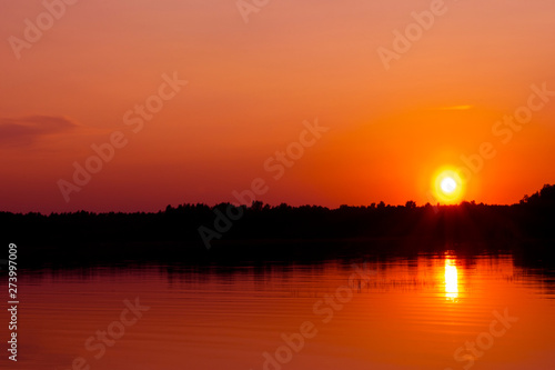 Sunset sky background. Dramatic gold sunset sky with evening sky clouds over the sea. Stunning sky clouds in the sunrise. Sky landscape. Panoramic sky view. © Aleksei