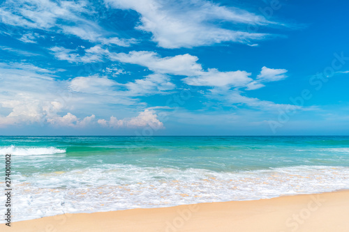 Beautiful tropical beach with blue sky and white clouds abstract texture background. Copy space of summer vacation and holiday business travel concept. © tonktiti