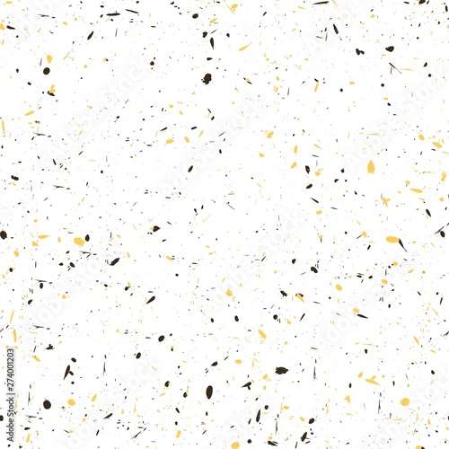 Splashes black and yellow on a white background.