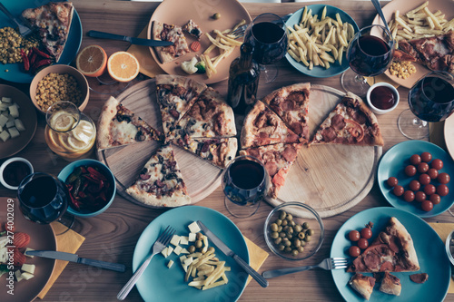 Close up top above high angle view photo holiday table full different dishes plates kitchen apply forks knifes no people woman man person inside loft room cafe restaurant indoors