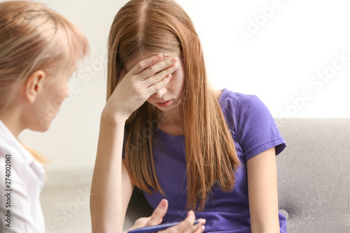 Female psychologist working...