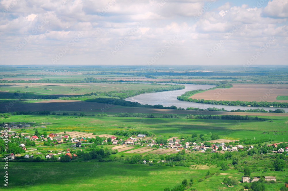 Panoramic bird's-eye view of the natural landscape: river, fields