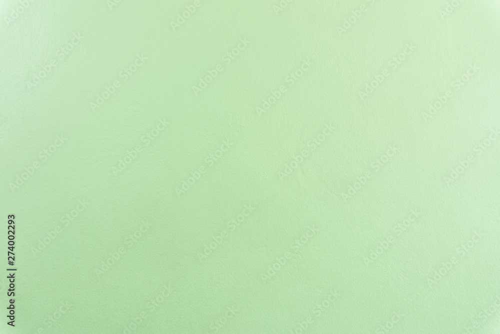 Fototapeta premium Soft green painted concrete cement texture wall background