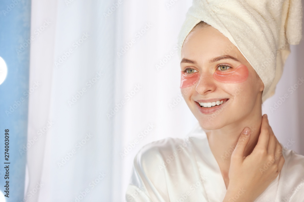Young woman with under-eye patches at home Young woman with under-eye patches at home