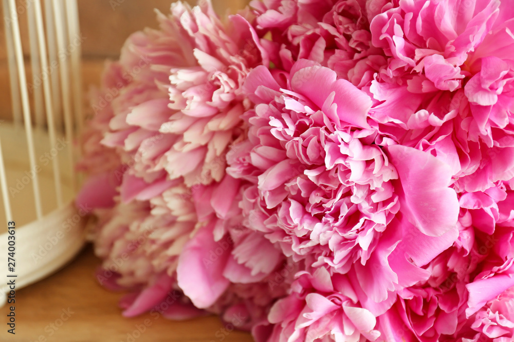Bouquet of beautiful peony flowers on table, closeup