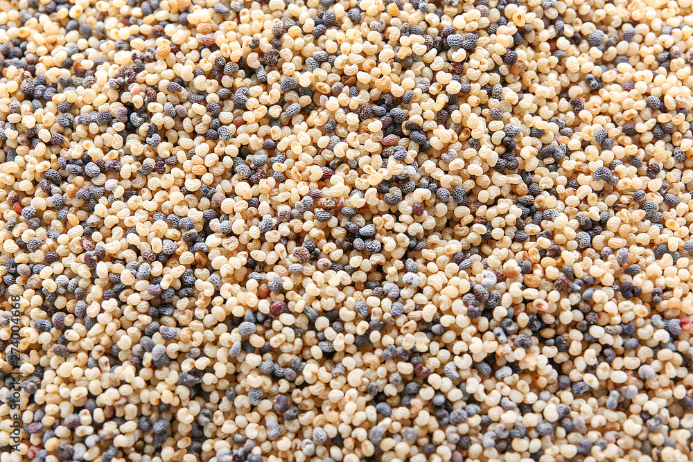 Many black and white poppy seeds as background Many black and white poppy seeds as background