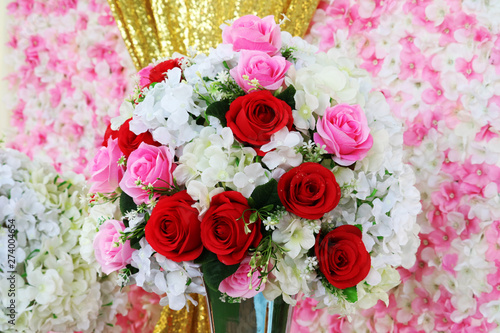 red and pink rose boutique flower decorate in wedding and blur orchid