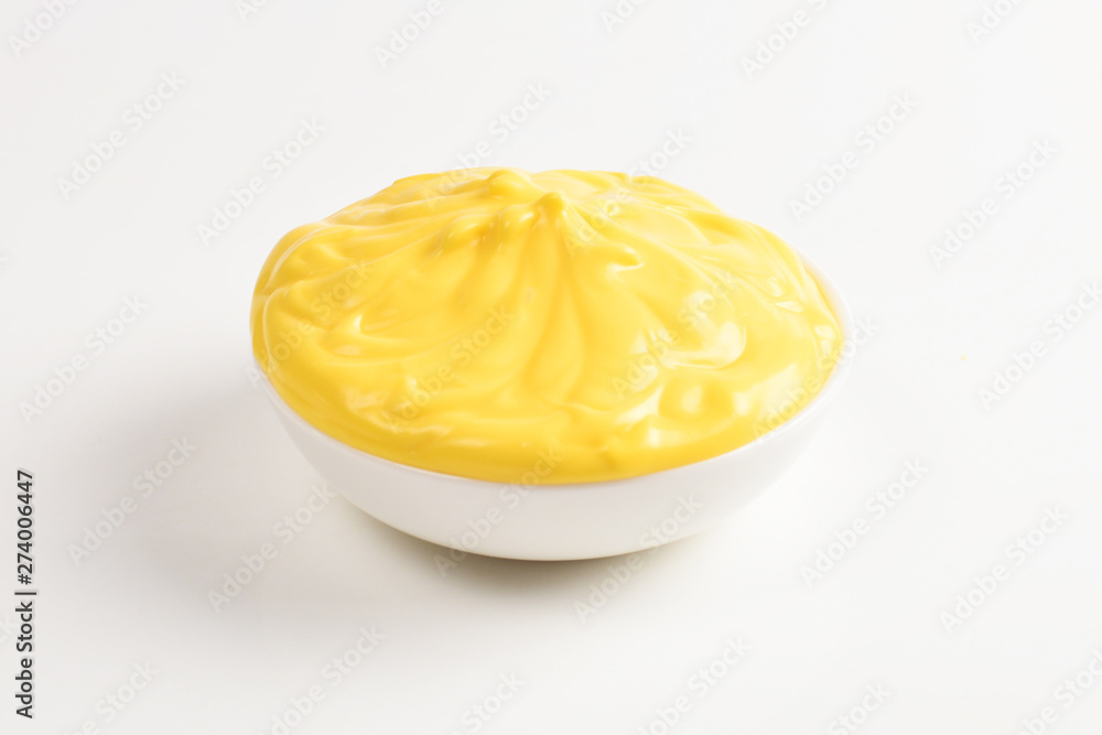 Cheese sauce in white plate on white background. Cheese sauce in white plate on white background.