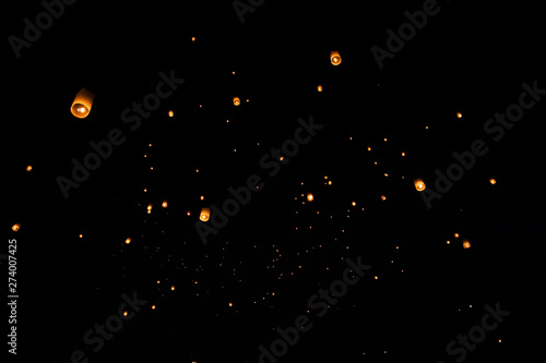 Loi Krathong and Yi Peng released paper lanterns on the sky during night photo