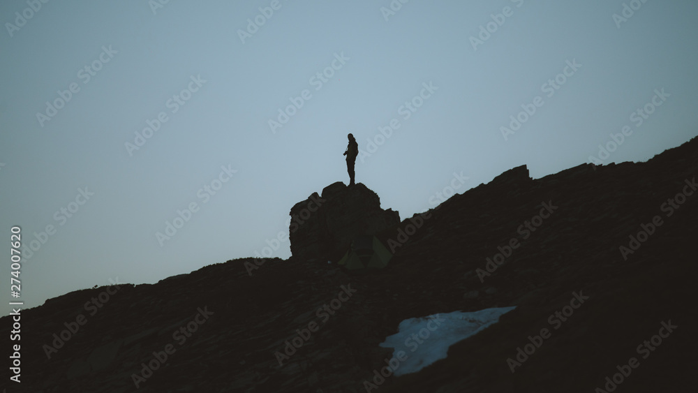 Lonely person on the top of a hill