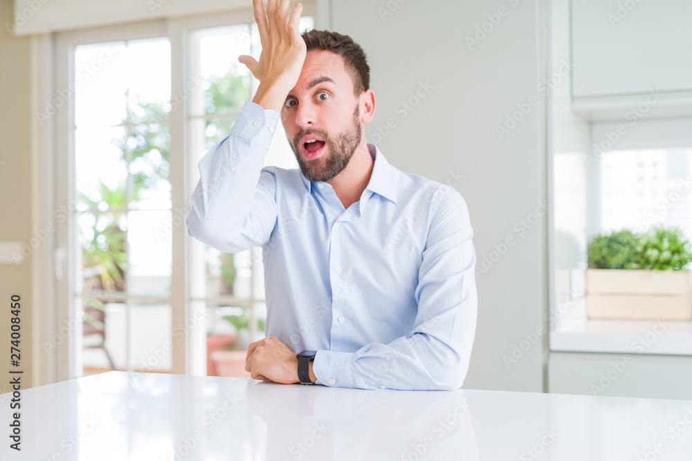Handsome business man surprised with hand on head for mistake, remember error. Forgot, bad memory concept. Handsome business man surprised with hand on head for mistake, remember error. Forgot, bad memory concept.