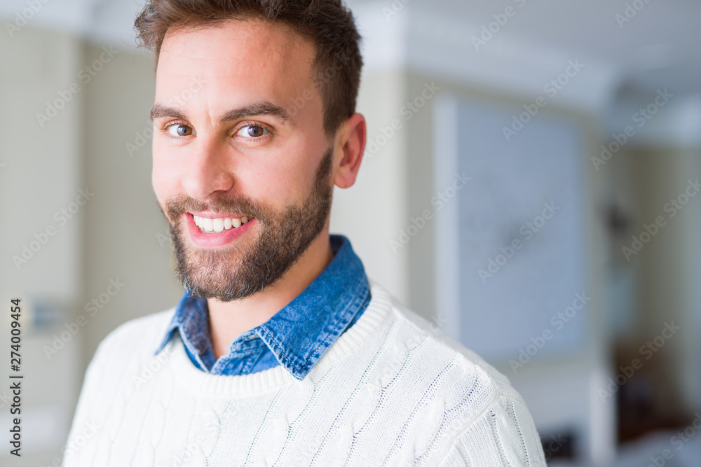 Handsome man smiling positive at the camera Handsome man smiling positive at the camera
