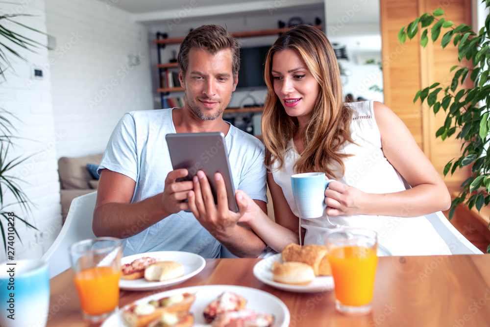 Couple having breakfast in their home