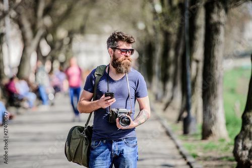 Photographer hold vintage camera. Modern blogger. Manual settings. Photographer with beard and mustache. Tourist shooting photos. Content creator. Man bearded hipster photographer. Old but still good