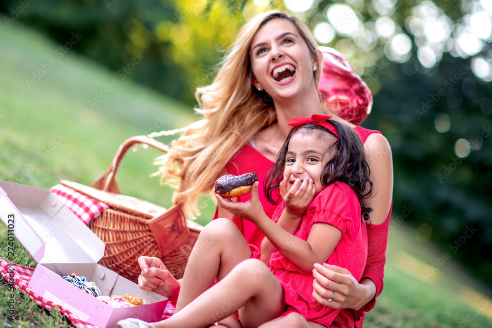 Family having picnic in summer park