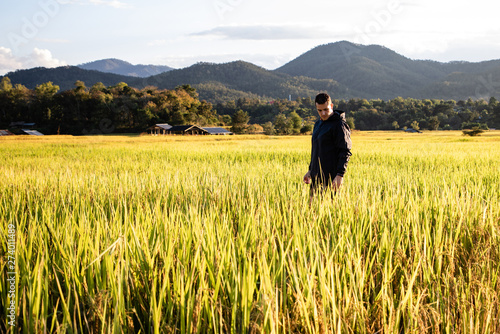 Handsome traveler man on rice fields in Thailand © Gabriel