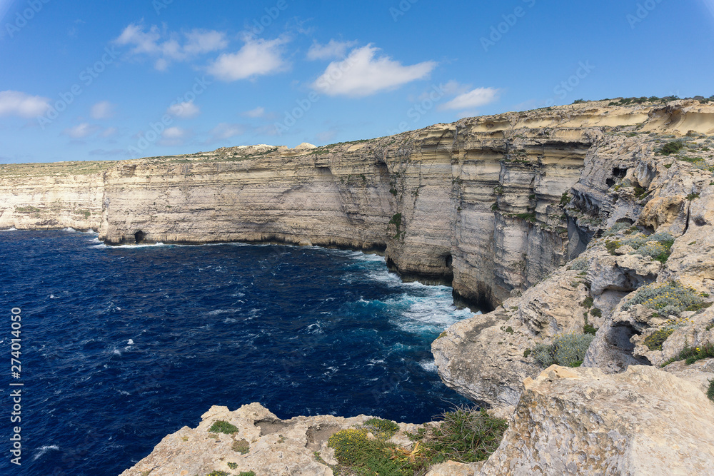 a coast with rough seas the Blue Hole in San Lawrenz on Gozo