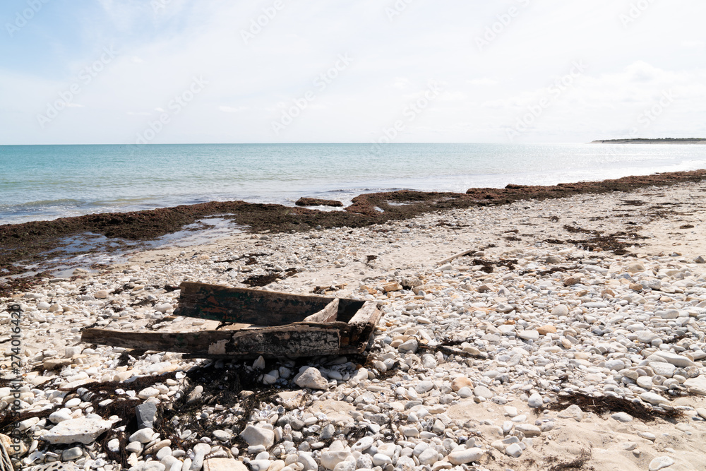 detail shipwreck small boat at the sandy beach detail shipwreck small boat at the sandy beach