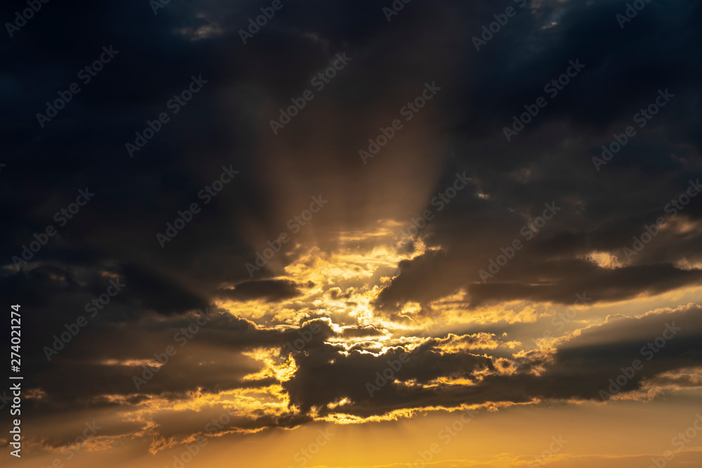 Golden Sun Rays Break Through the Clouds - Beautiful Nature Background