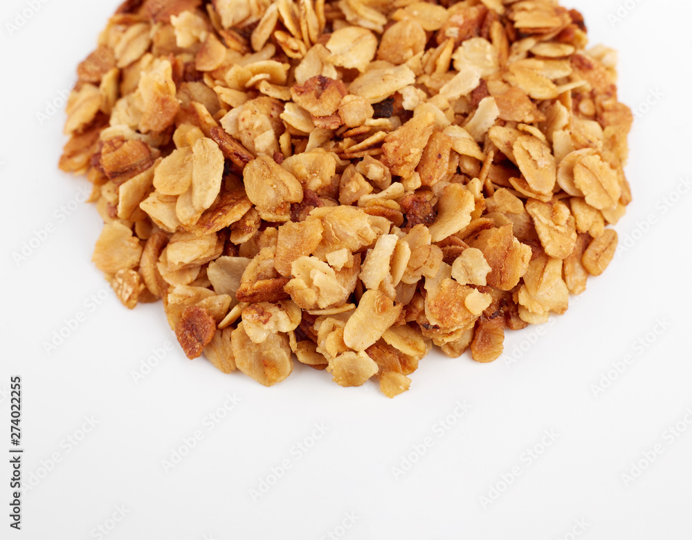 Organic homemade Granola Cereal with oats and almond. Texture oatmeal granola or muesli as background. Food concept. Healthy and wholesome food. Organic homemade Granola Cereal with oats and almond. Texture oatmeal granola or muesli as background. Food concept. Healthy and wholesome food.