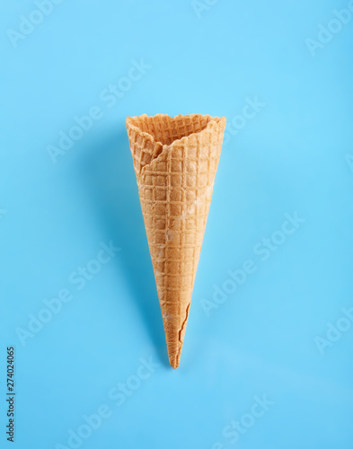 waffle ice cream cone isolated on blue background
