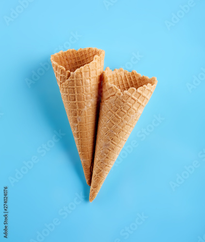 waffle ice cream cone isolated on blue background