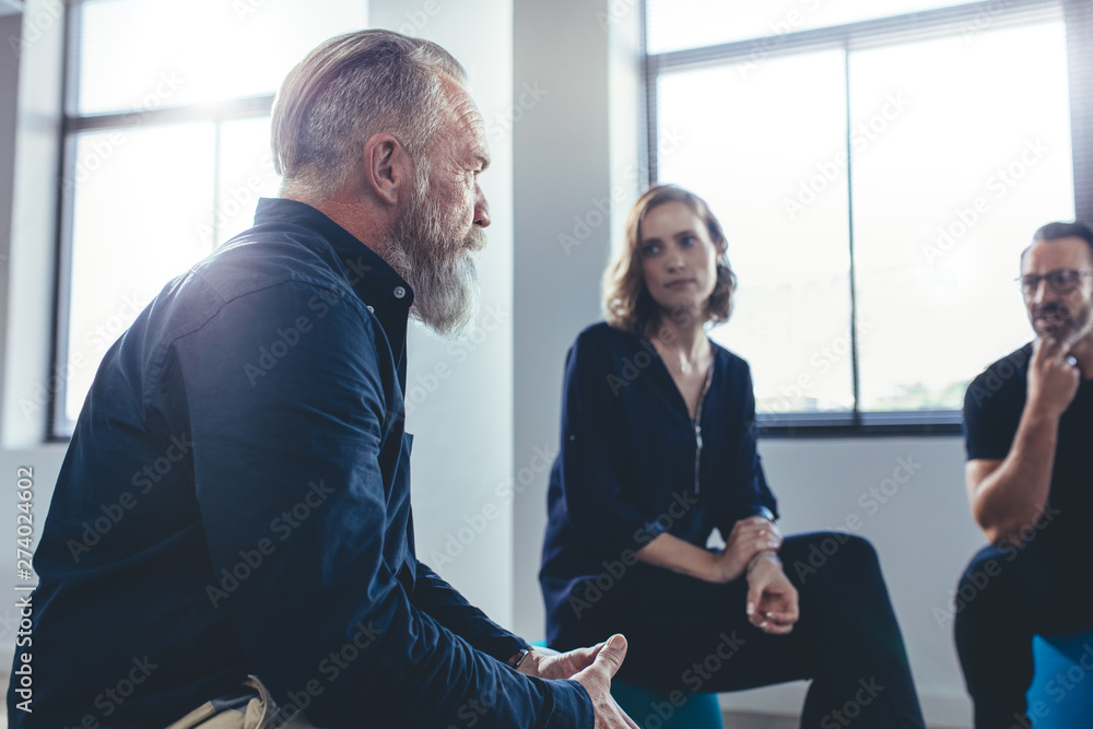 Business team discussing in a meeting Business team discussing in a meeting