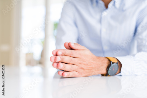 Close up of man hands over white table