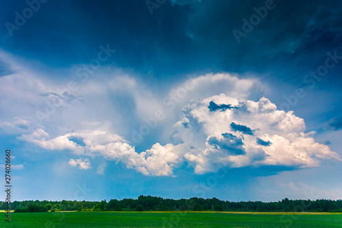 Cumulus storm clouds running across the sky photo