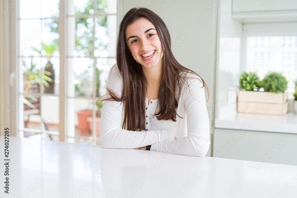 Beautiful young brunette woman smiling cheerful looking at the camera with a big smile on face showing teeth Beautiful young brunette woman smiling cheerful looking at the camera with a big smile on face showing teeth