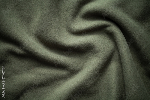 Background texture of dark green fleece