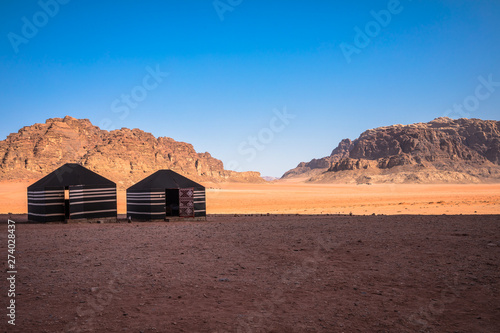 Red sand desert and Bedouin camp at sunny summer day in Wadi Rum  Jordan. Middle East.