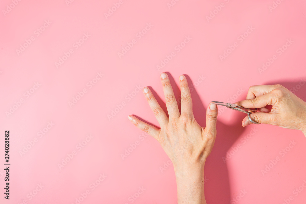 Fotografie Nail cutter  macro detail pink background