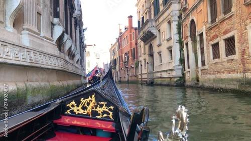 View of the Canal in Venice, Italy. Gondoliers on gondolas on the background of the views of Venice