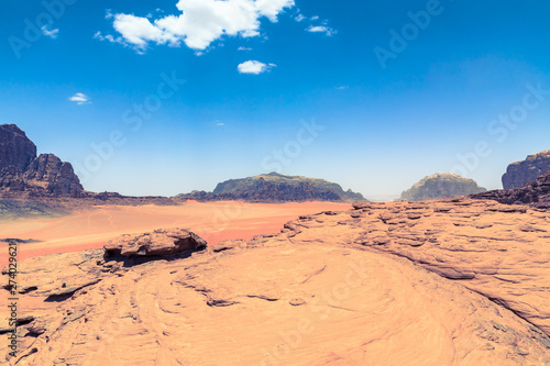 Red sand desert at sunny summer day in Wadi Rum, Jordan. Middle East. UNESCO World Heritage Site and is known as The Valley of the Moon.