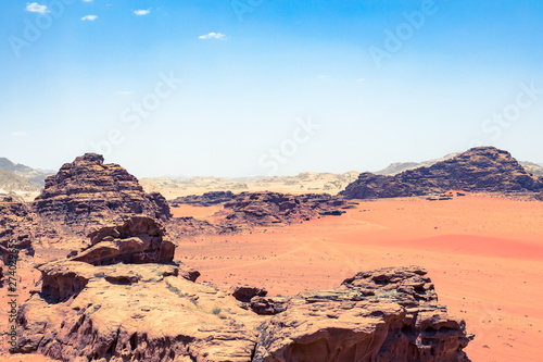 Red sand desert at sunny summer day in Wadi Rum, Jordan. Middle East. UNESCO World Heritage Site and is known as The Valley of the Moon.