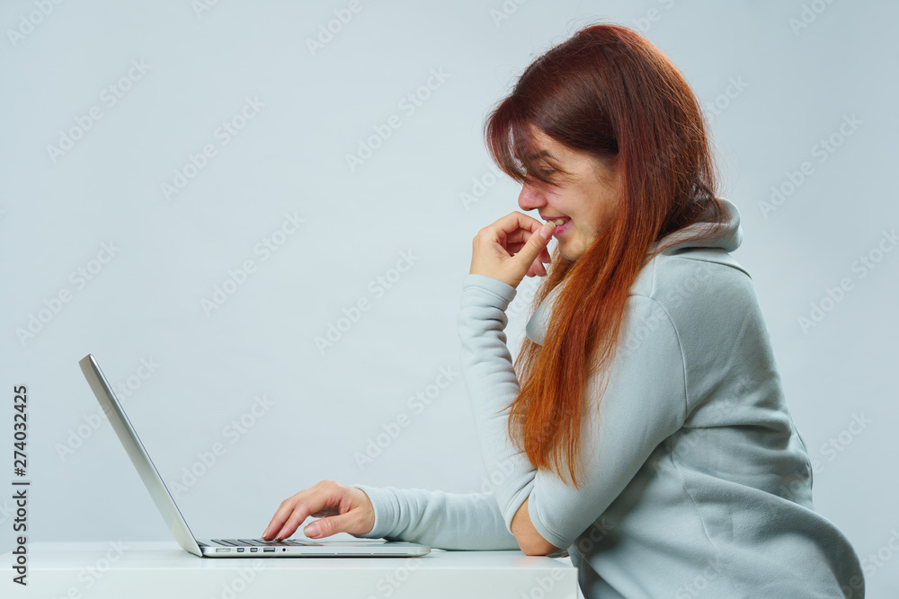 Woman is using laptop for communication in chat or video chat. Social media concept. Woman is using laptop for communication in chat or video chat. Social media concept.