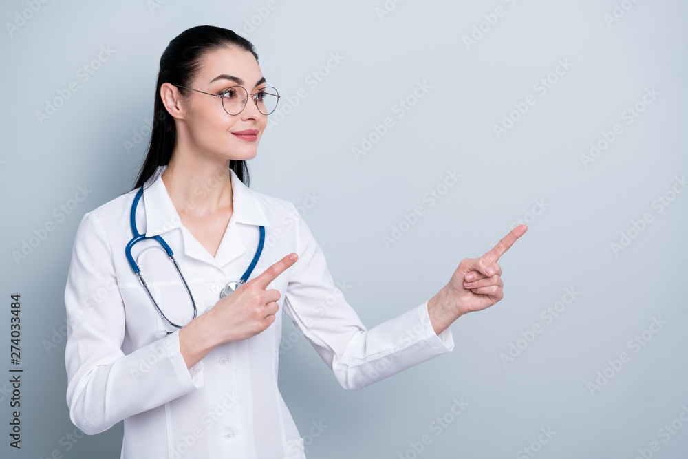 Close up photo beautiful she her lady doctor hospital indicate fingers hands empty space advising use pills wear phonendoscope white science costume specs eyeglasses eyewear isolated grey background Close up photo beautiful she her lady doctor hospital indicate fingers hands empty space advising use pills wear phonendoscope white science costume specs eyeglasses eyewear isolated grey background