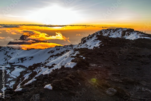 Meeting sunset on the roof of Africa. Kilimanjaro mountain, Uhuru peak 5895m photo