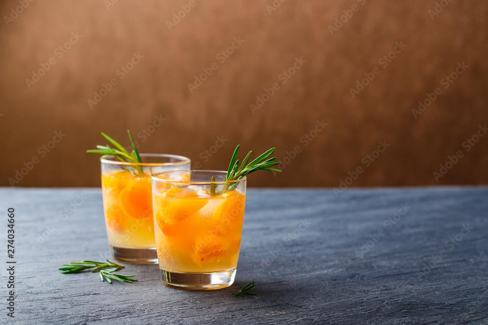 Fototapeta premium Summer drinks, rosemary aprcot cocktails.