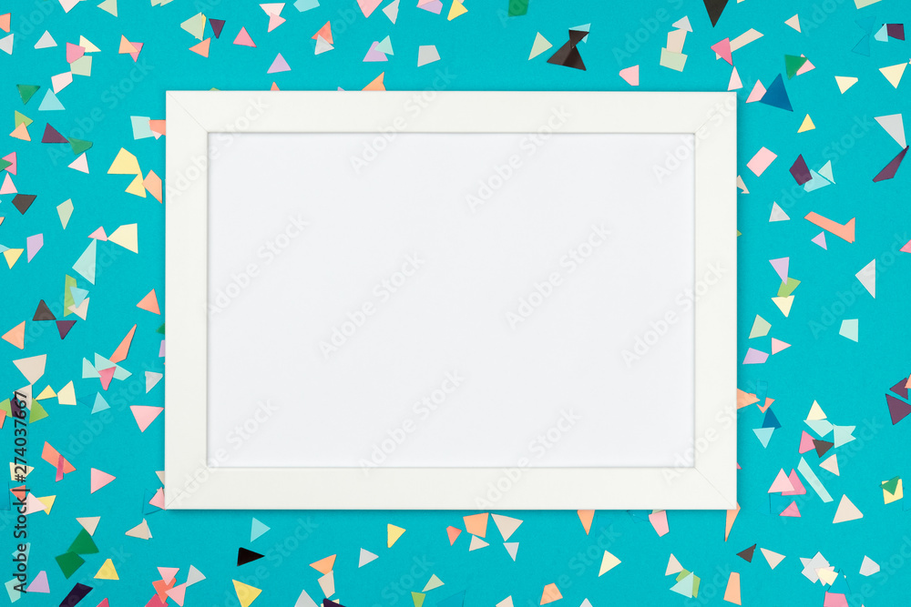 White frame on colorful table top view