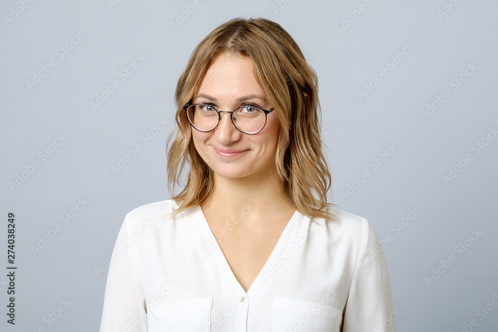 Portrait of young beautiful shy girl smiling Portrait of young beautiful shy girl smiling