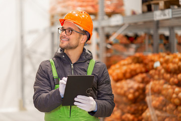 Man working at food factory warehouse.
