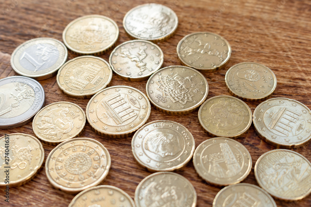 coins euro pile pack heap on a wooden background with space for an inscription mock up selective focus close up coins euro pile pack heap on a wooden background with space for an inscription mock up selective focus close up