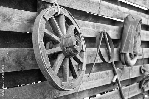 black and white photograph of an old wheel from a village cart