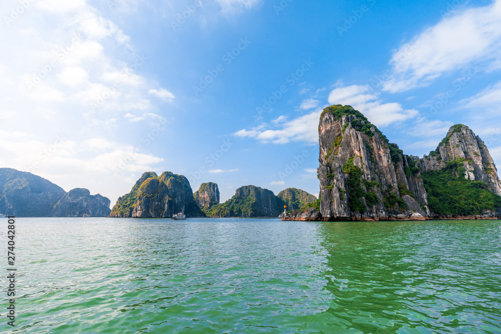 Beautiful scenery views cruising at Ha Long Bay, Hanoi, Vietnam. blue sky background summer season sunset emerald waters ocean sea, World Heritage Asia National Park Asian outdoors destinations Beautiful scenery views cruising at Ha Long Bay, Hanoi, Vietnam. blue sky background summer season sunset emerald waters ocean sea, World Heritage Asia National Park Asian outdoors destinations
