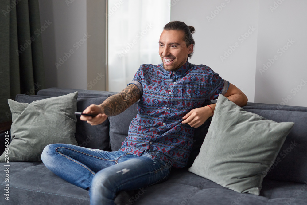 Cheerful man watching TV Cheerful man watching TV