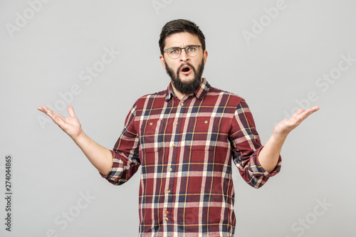 Man over isolated background clueless and confused expression