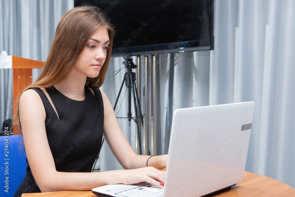 Happy Young Beautiful Woman Using Laptop, Indoors Happy Young Beautiful Woman Using Laptop, Indoors